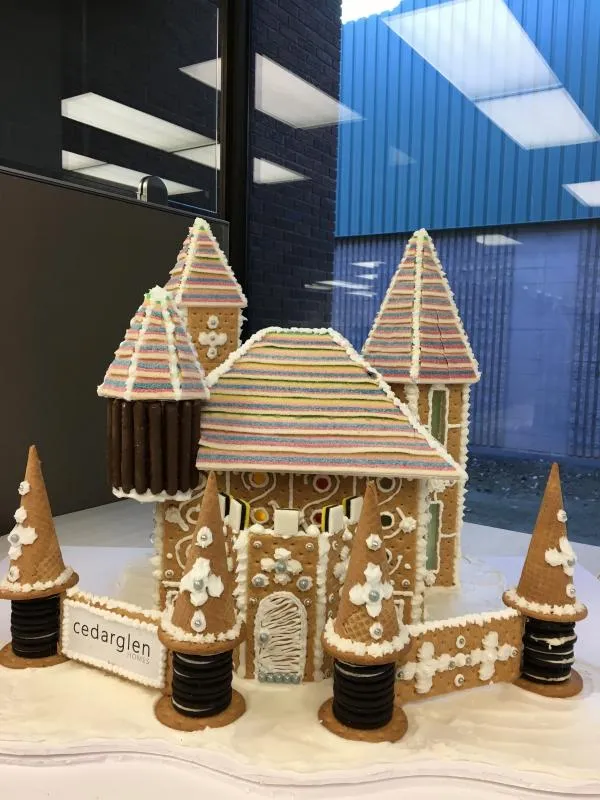 Gingerbread castle with striped cone turrets, candy-cane trim and a tall centre tower